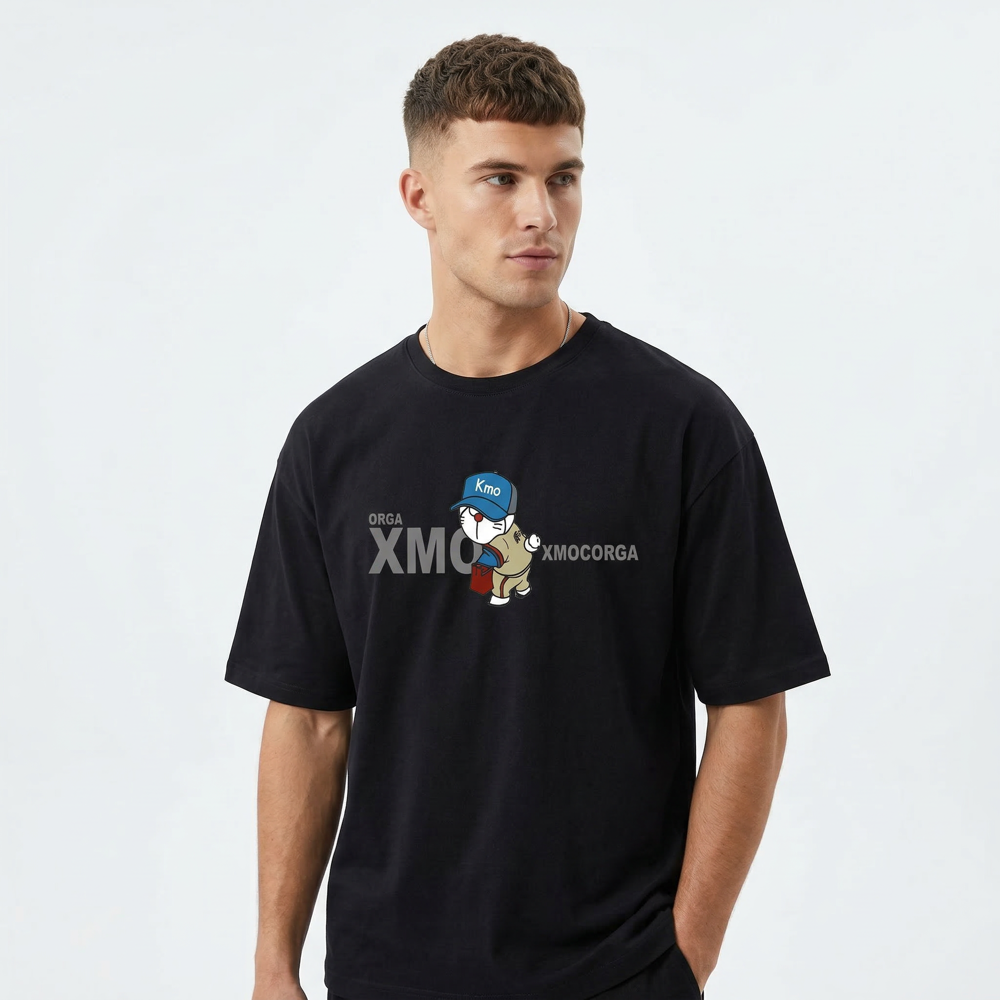 Oversized M K D T-shirt by Details in black, featuring a relaxed fit and casual style, displayed on a white background.