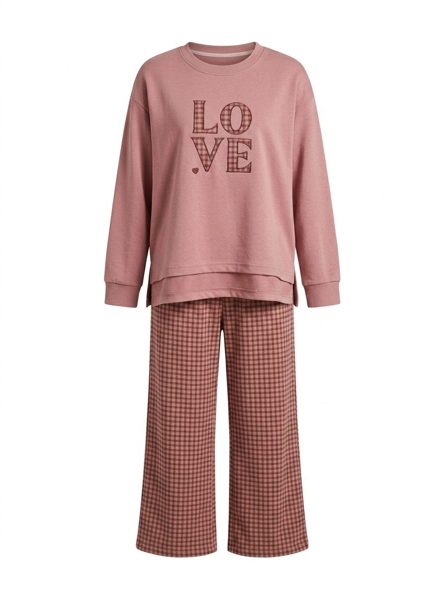 YAYA LOVE L.S & Pajama set featuring a long-sleeve top and matching pants in soft fabric with playful heart patterns.