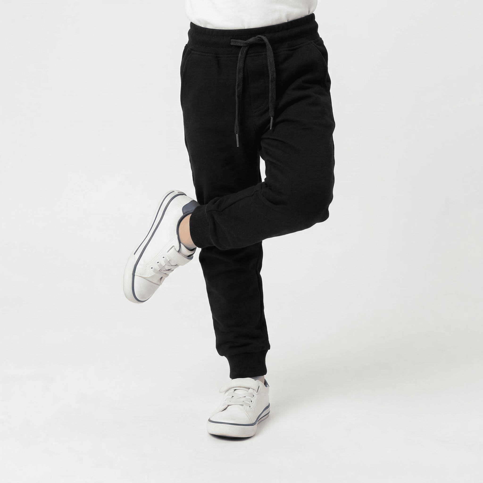 Kids basic sweatpants by Details, shown in soft fabric with elastic waistband and cuffs, perfect for casual wear.