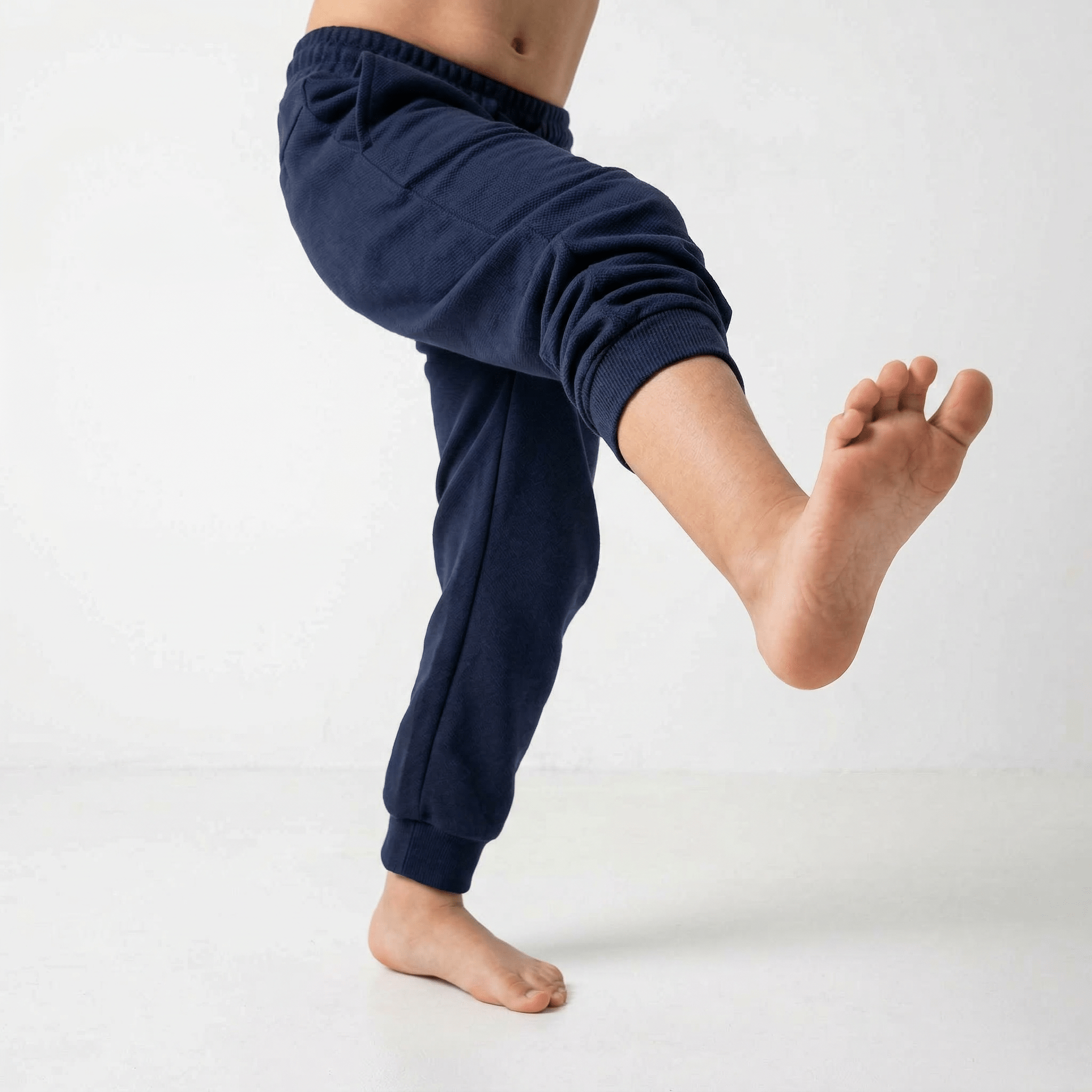 Kids Basic Sweatpant from Details, soft and comfortable navy blue casual joggers for children with elastic waistband and cuffs.