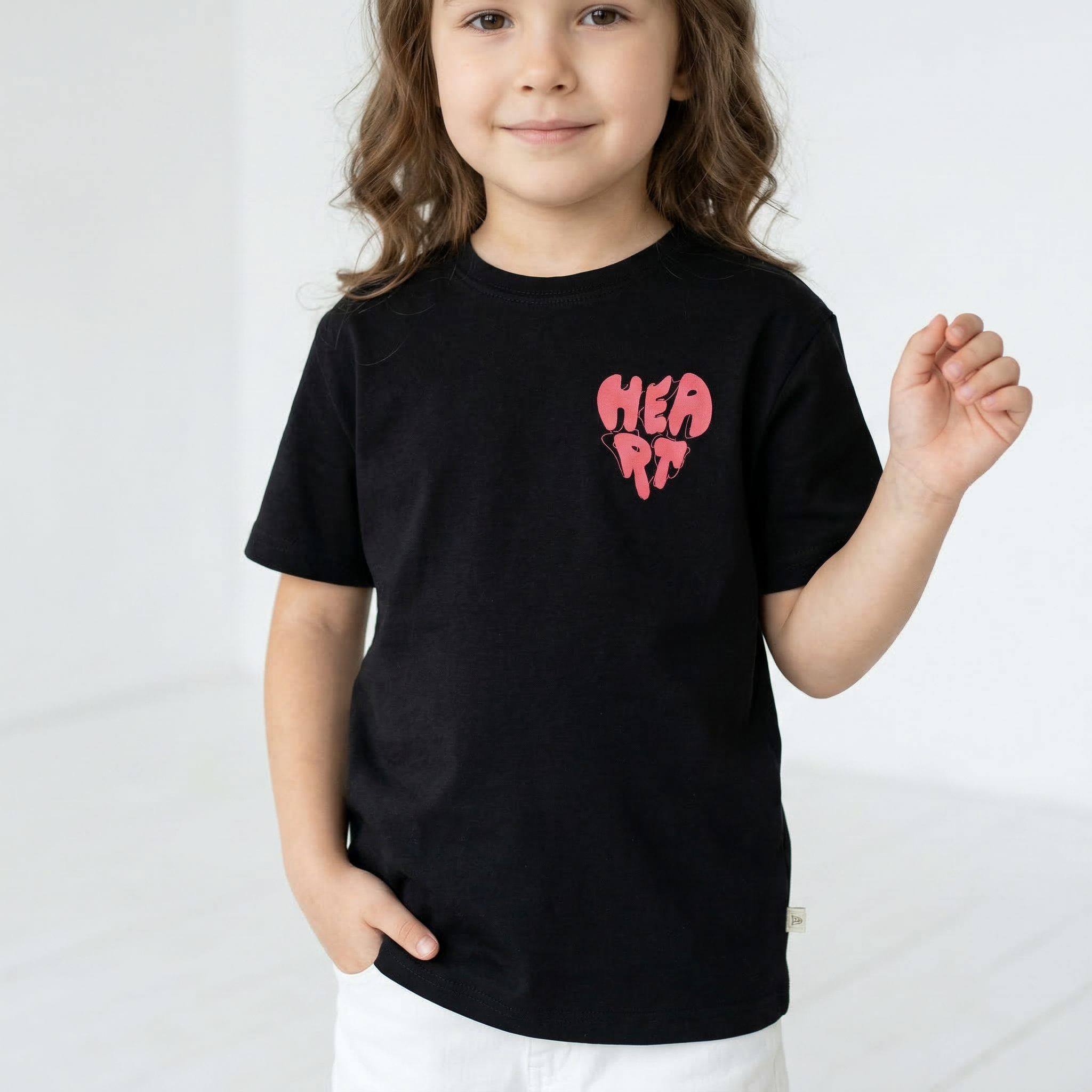 Angel brand heart T-shirt featuring a red heart graphic on soft cotton fabric, casual style for everyday wear.