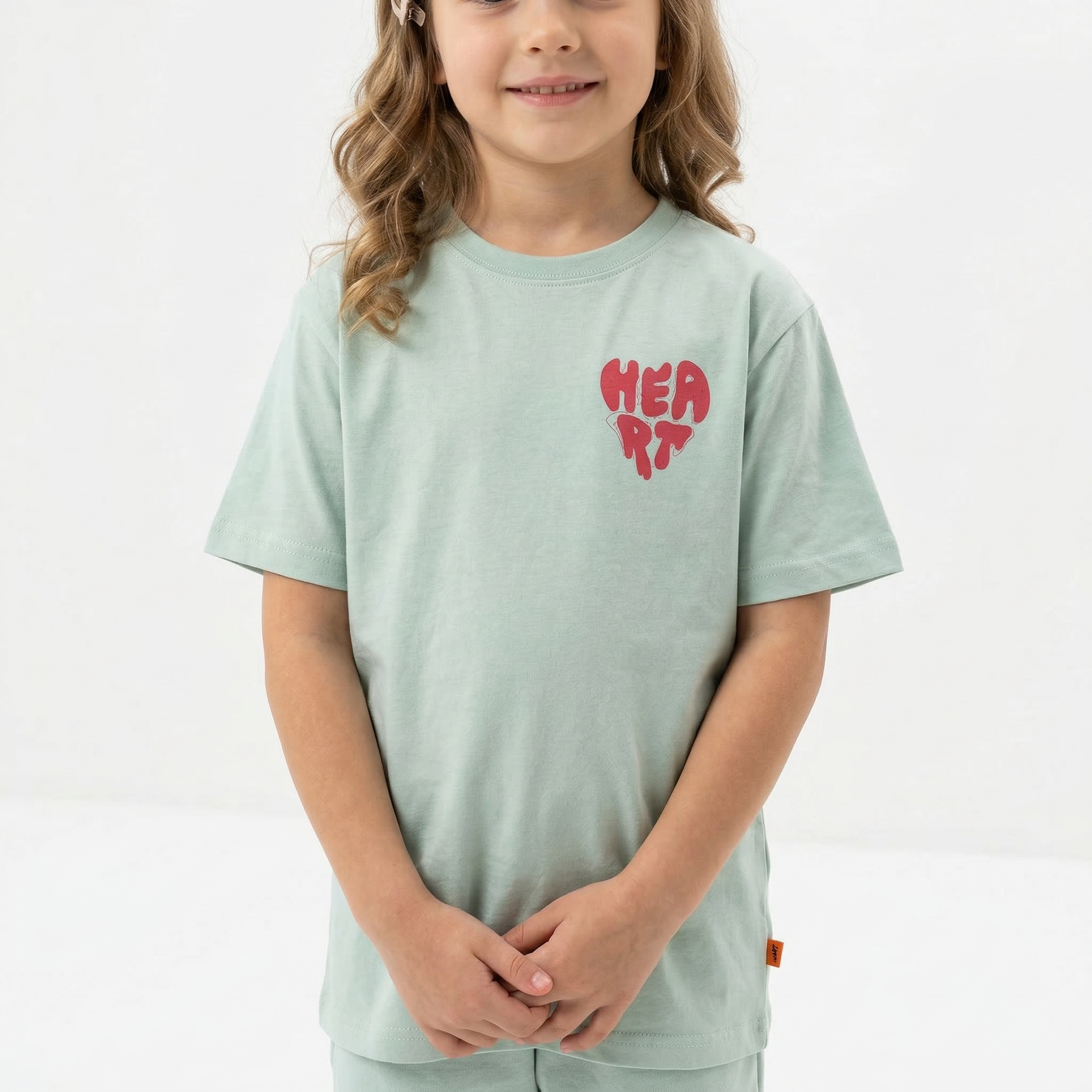 Angel Heart T-shirt featuring a red heart graphic on soft cotton fabric, casual fit, perfect for everyday wear.