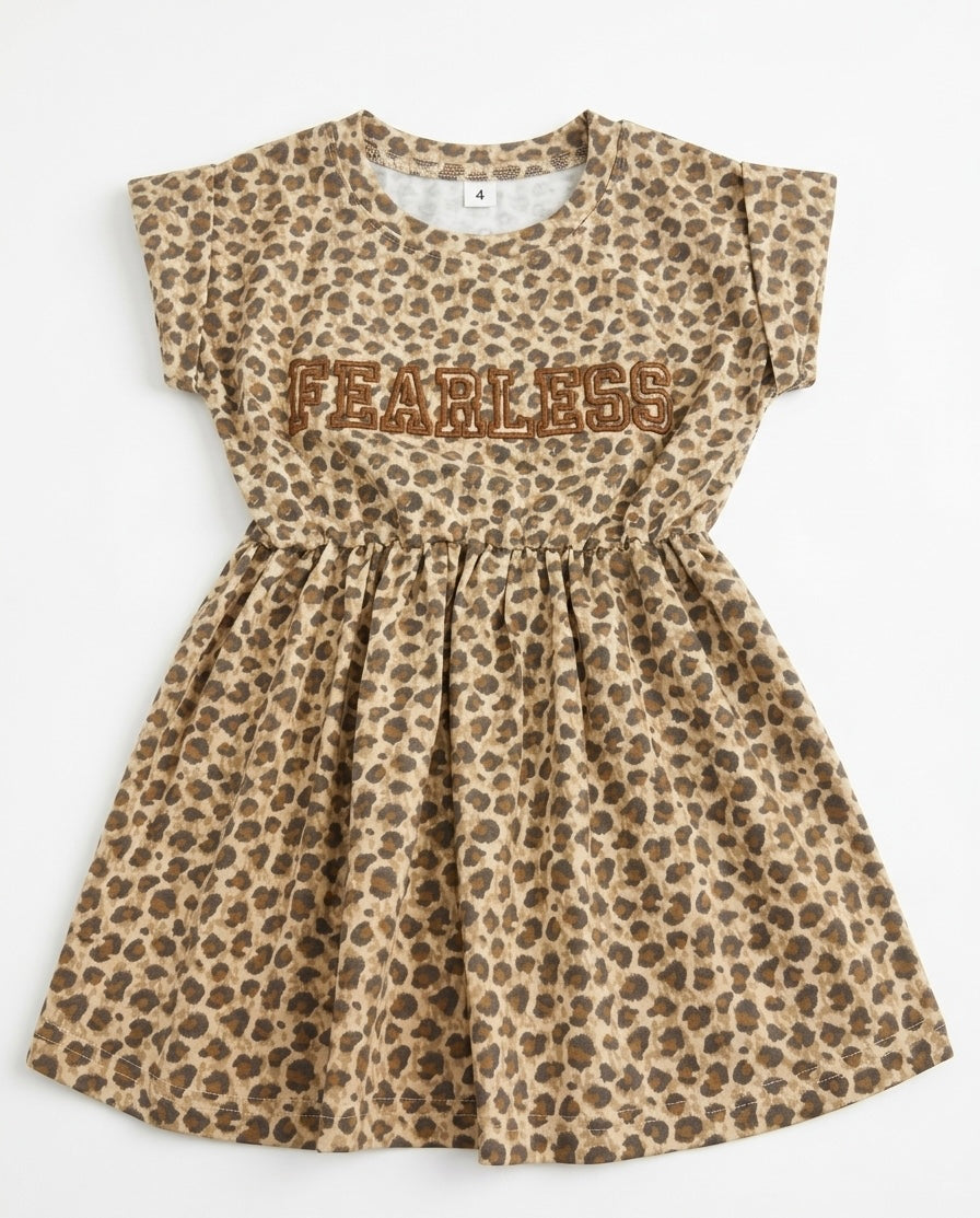 YAYA Fearless Tiger Dress featuring bold tiger print, sleeveless design, and fitted silhouette on model.