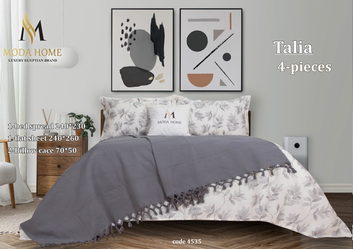 MODA HOME Talia 4-piece floral printed double coverlet set with matching pillowcases on a bed, showing vibrant floral design.