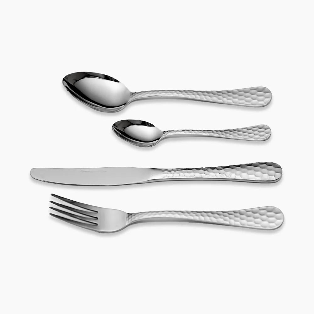 Set of 30 Husseiny Youssef table forks and spoons displayed together on a table, showcasing stainless steel cutlery.
