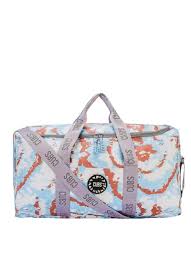 Baby blue tie dye Weekendeنطة by CUBS, featuring a colorful, patterned fabric bag with adjustable straps and casual style.