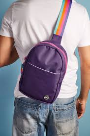 CUBS purple sling shoulder bag with front pocket, casual style, adjustable strap, and compact design for everyday use.