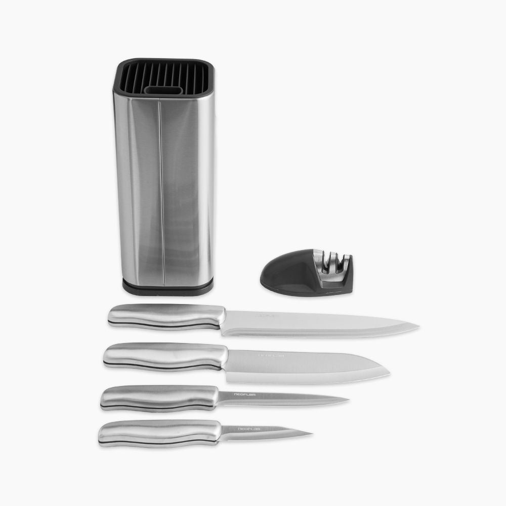 Set of four Neoflam kitchen knives with a sharpening stone and stand, displayed on a modern countertop.