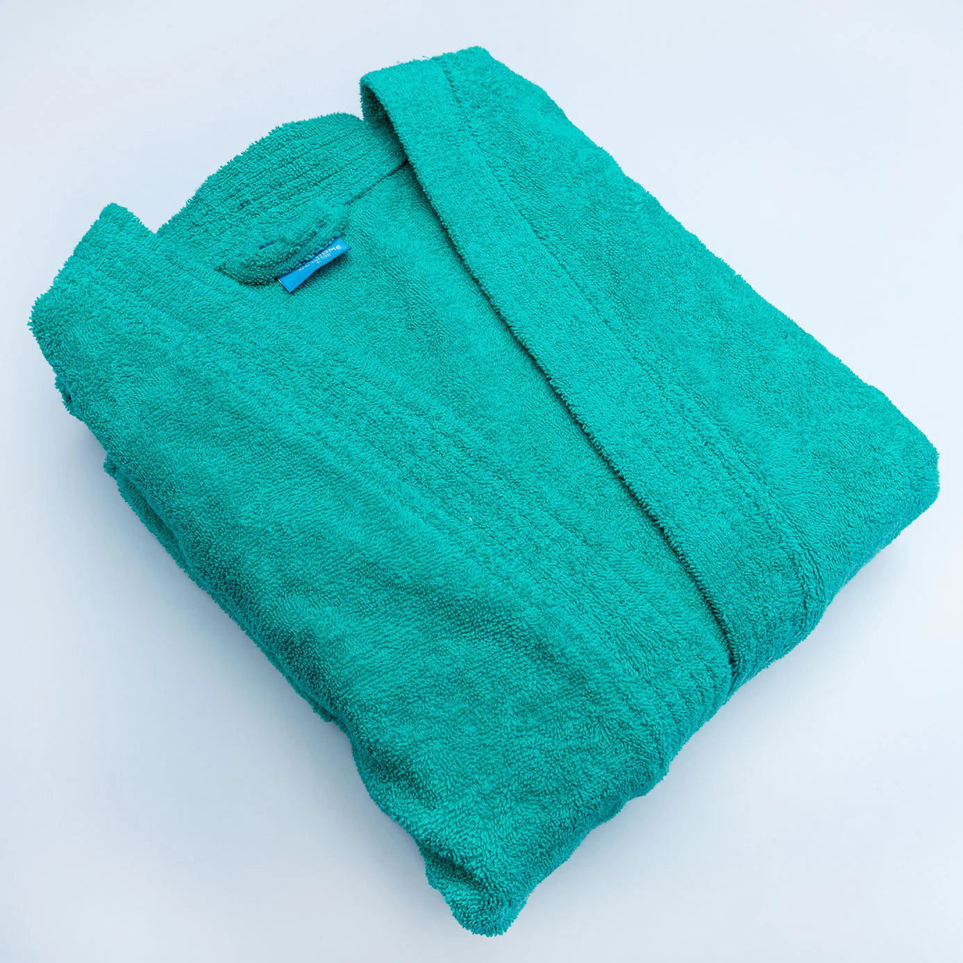 Bashkir plain cotton bathrobe from Moda Home, showing soft, lightweight fabric and classic design in neutral color.