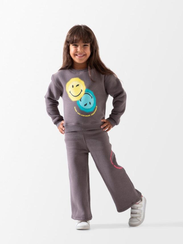 Sotra ITS GOOD DAY SMIL khaki set with pants and top, casual and stylish, displayed on a hanger.
