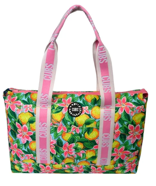 Colorful tropical fruit print tote bag by CUBS, featuring vibrant fruit images on durable canvas for casual or beach outings.