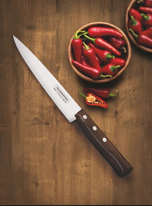 TRAMONTINA tradicional cooks سكينة knife with stainless steel blade and ergonomic handle, suitable for kitchen cooking tasks.