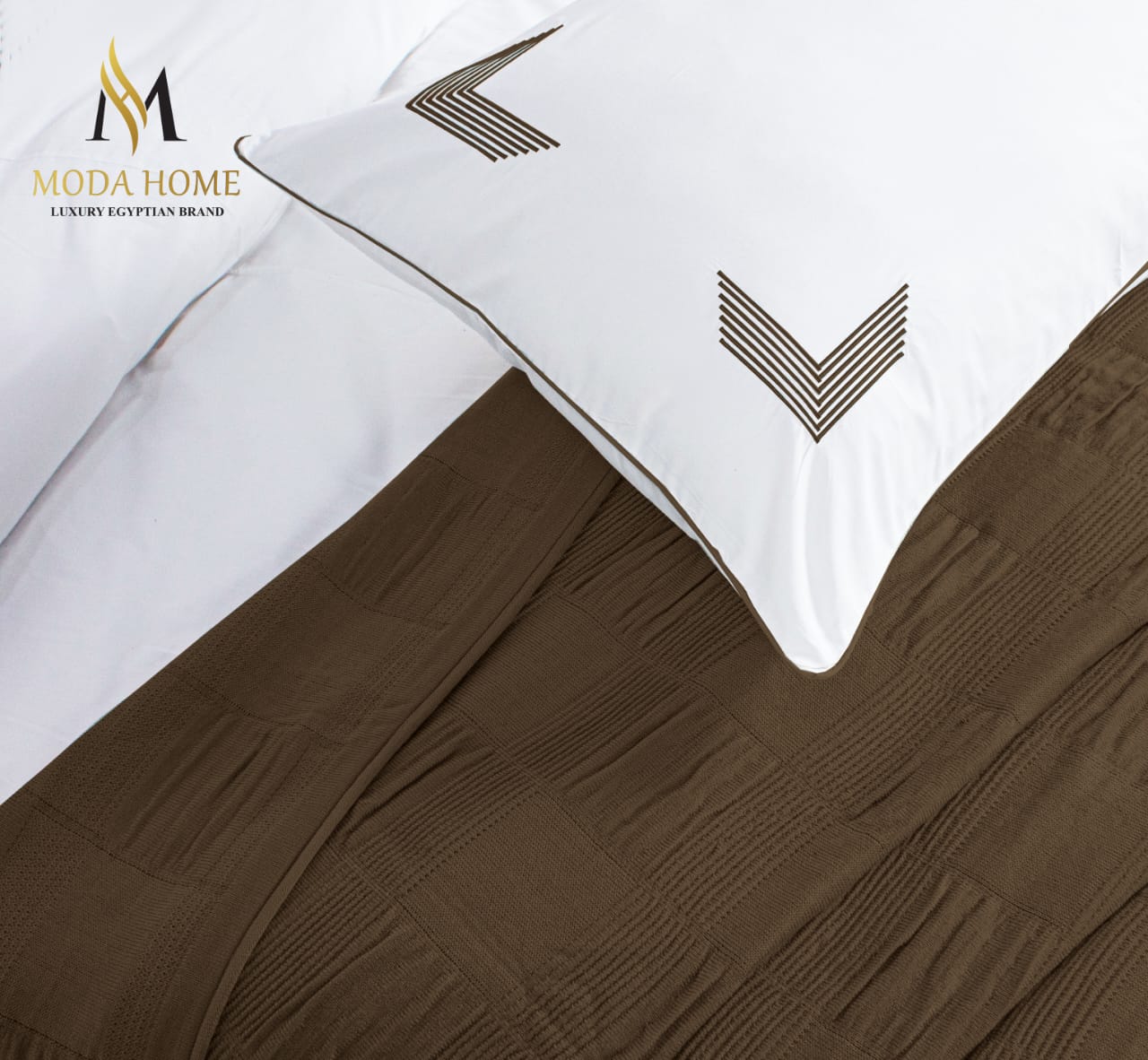 MODA HOME X-One Plain 4-piece coverlet set in neutral fabric, includes duvet cover, pillow shams, and bed skirt on a neatly made bed.