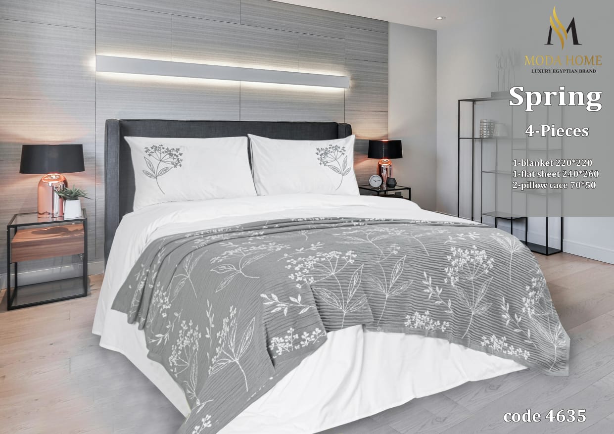 Spring 4-piece coverlet set from MODA HOME featuring a soft fabric and floral design, shown on a neatly made bed.