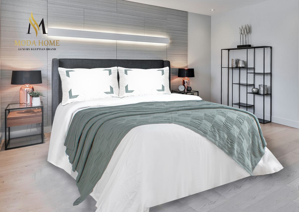 MODA HOME X-One Plain 4-Piece Coverlet Set in neutral fabric, showcasing the smooth, modern design on a neatly made bed.
